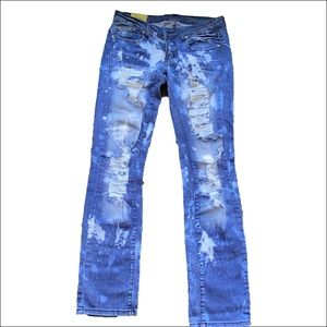 Ripped Blue Jeans with bleach stains